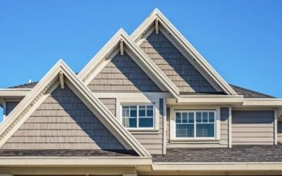 Facade of a house with nice windows in the blue sky background. Beautiful Home Exterior. Real Estate Exterior Front House in a residential neighborhood. Nobody, street photo, copy space for text